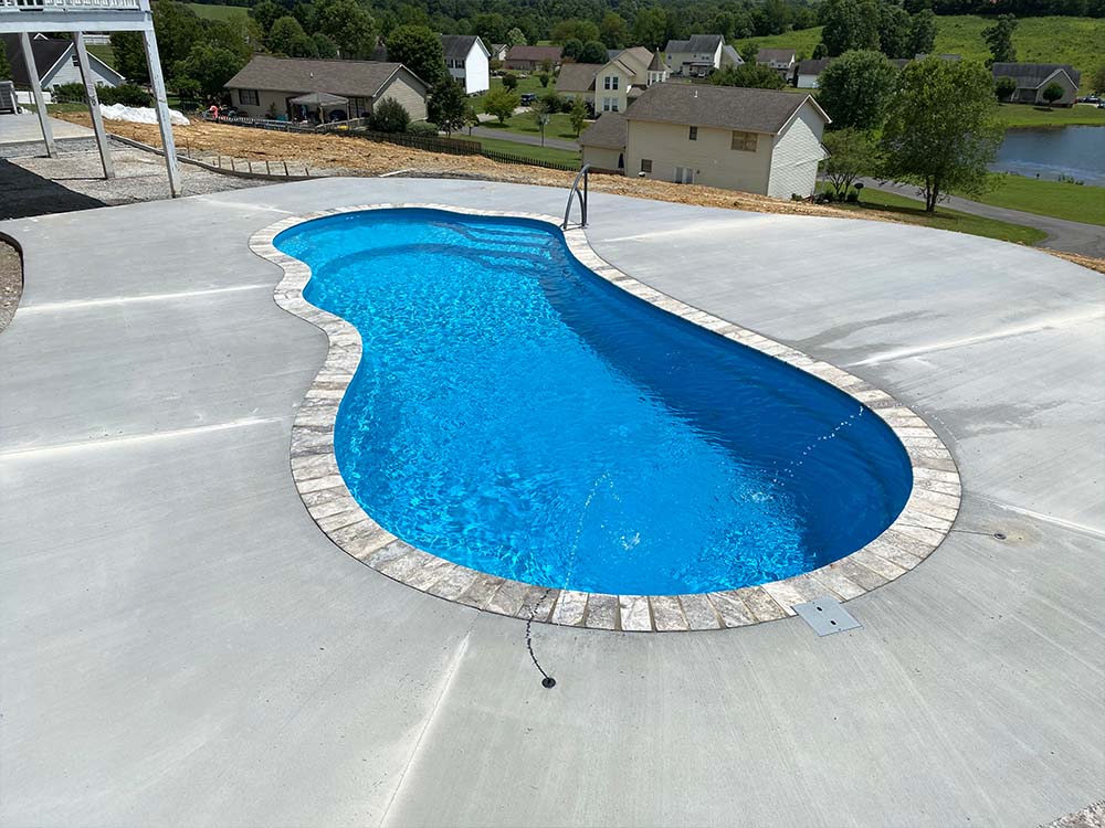 Inground vinyl liner pool with serene blue water