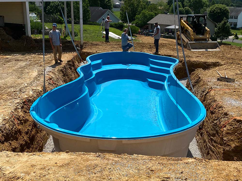 Custom-designed vinyl liner pool with mosaic accents
