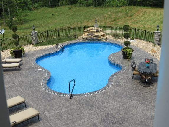Vinyl pool with pergola and outdoor kitchen