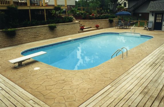 Vinyl pool with fire pit and seating area