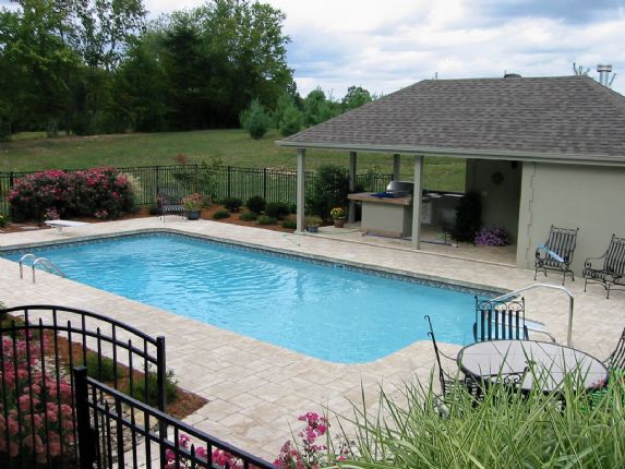 Vinyl pool with pergola and outdoor seating