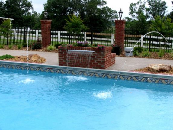 Vinyl pool with elevated spa and spillway